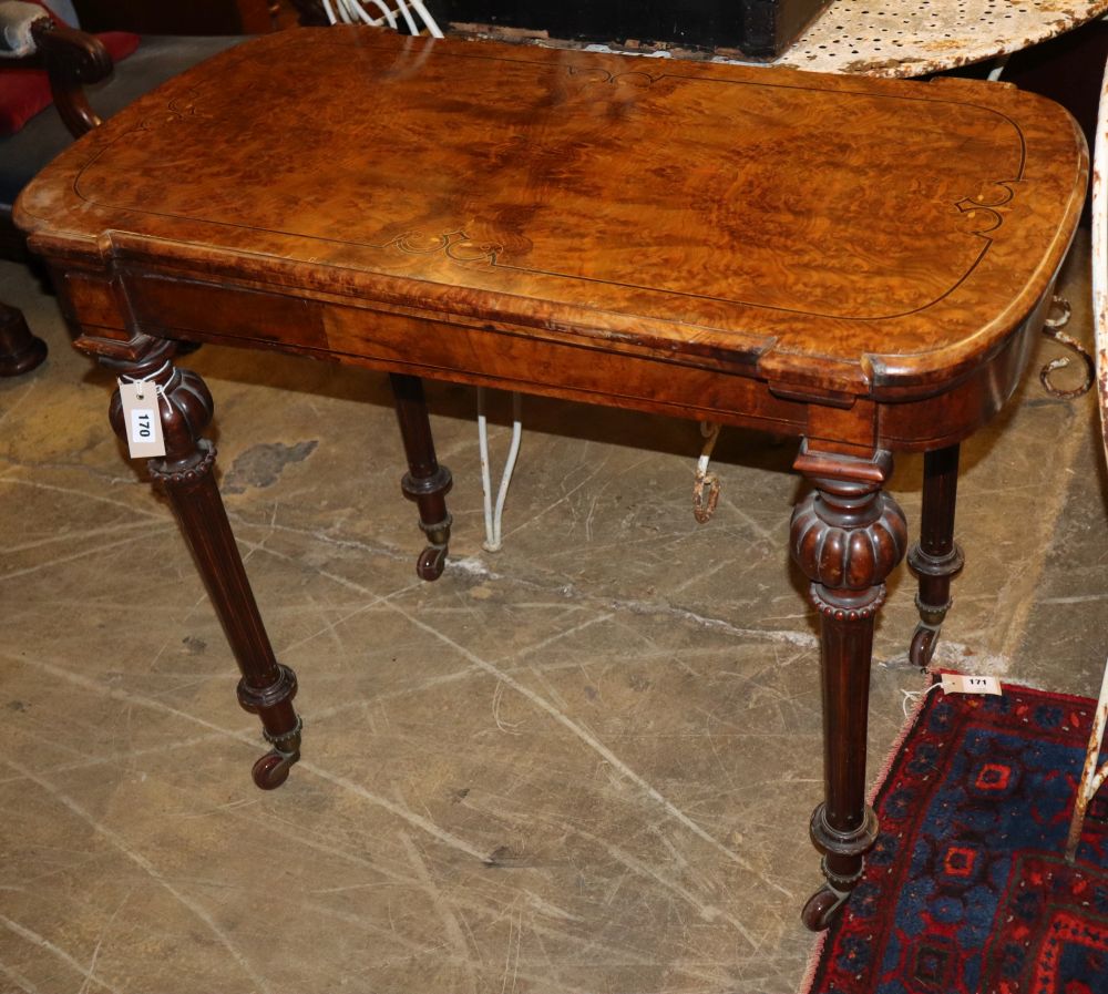 A Victorian walnut card table (one leg in need of restoration), W.96cm, D.52cm, H.75cm